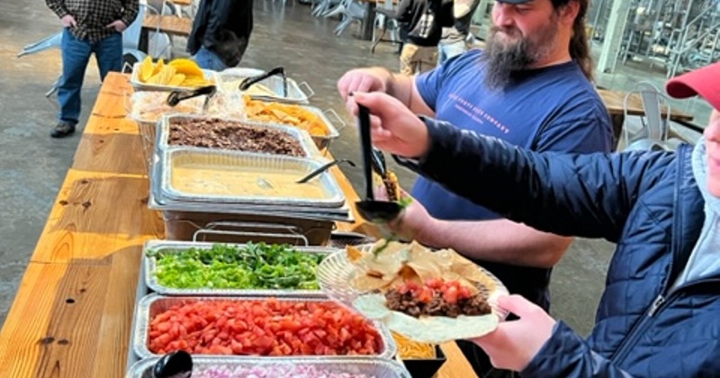Taco bar with guests serving themself