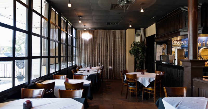 Interior, tables surrounded by windows
