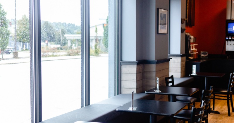 Interior, tables and seating by a window side