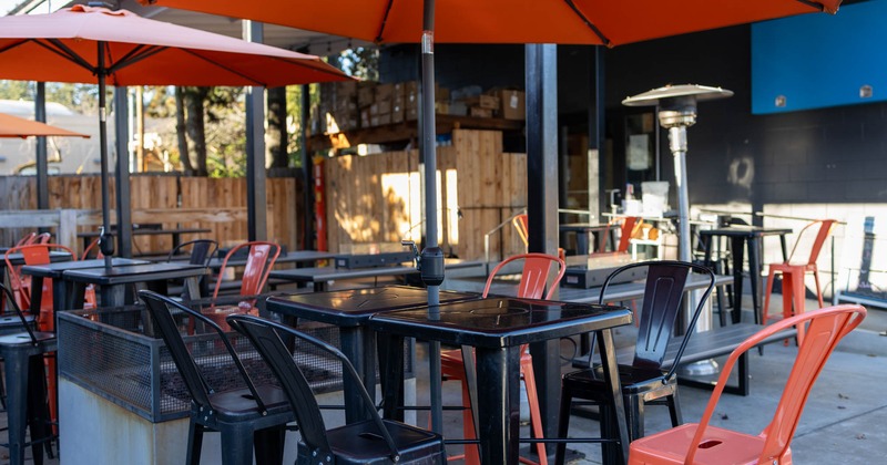 Outside, tables, chairs, parasols