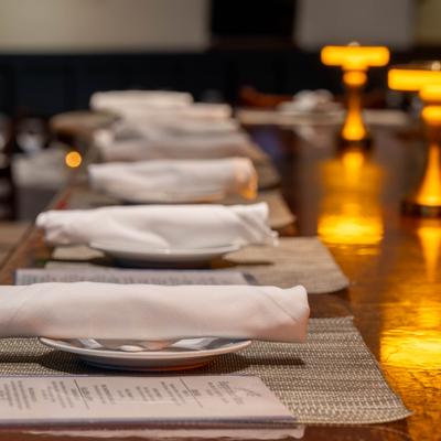 Bar counter set with napkins, plates, and menus.