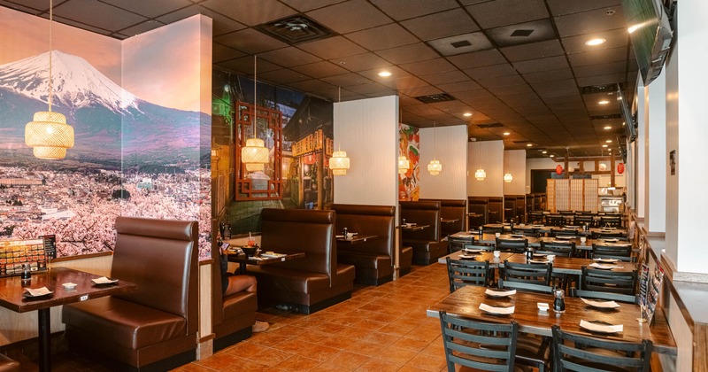 Restaurant interior with booth seating and Mount Fuji wall mural