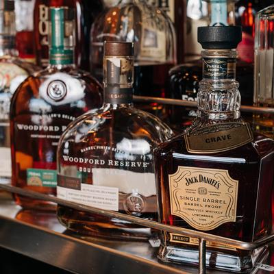 Assorted bottles of whiskey.