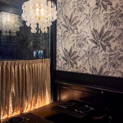 This is a photo of a corner booth inside the restaurant during the evening without any customers..