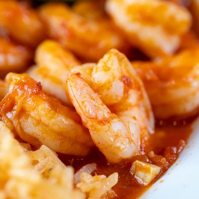 Close-up of spicy shrimp with rice.