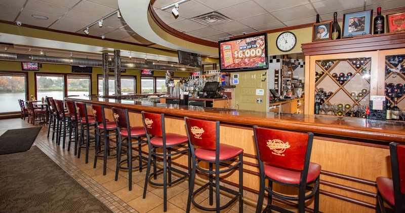 Interior, bar area, neatly lined up bar stools