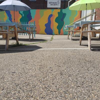Exterior, seating area, benches and parasols.