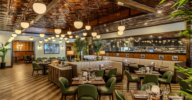 Modern, spacious, and cozy interior dining area with set tables