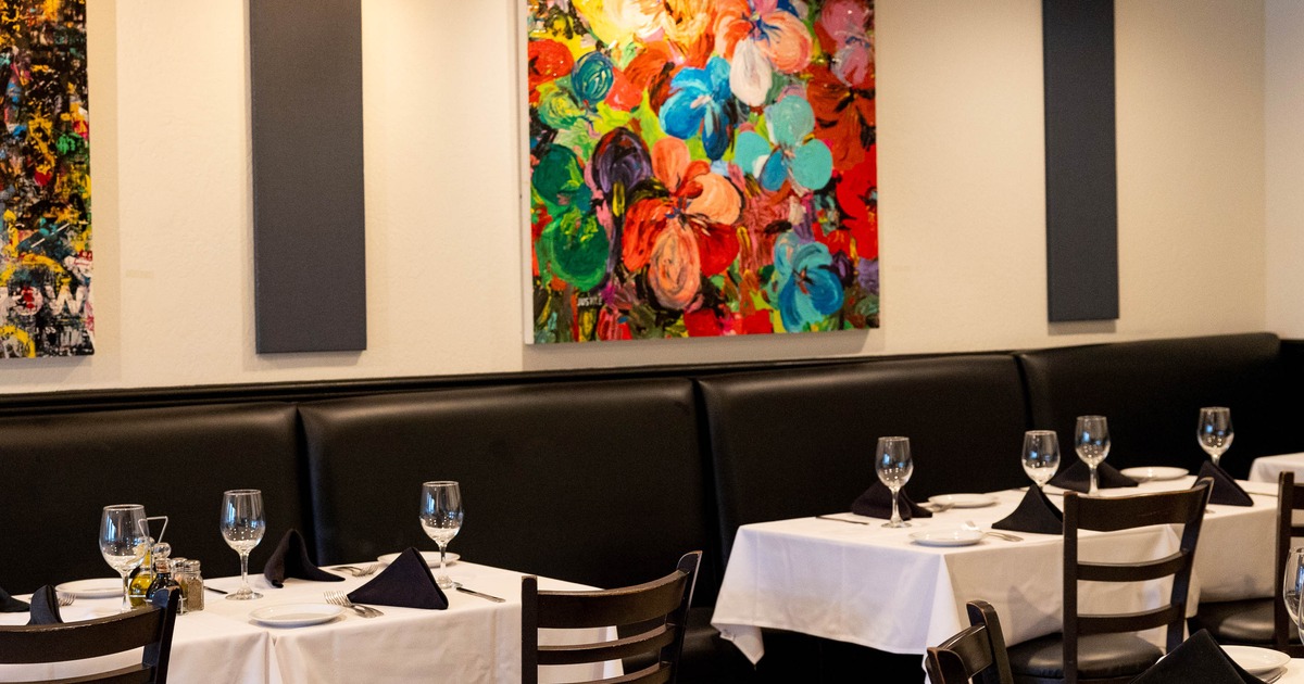 Interior, long seating bench near wall with picture