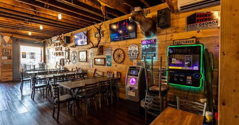 Spacious and rustic interior seating area with wooden tables and chairs
