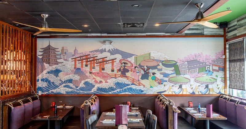 Interior, dining area with set tables, wall mural in Japanese style
