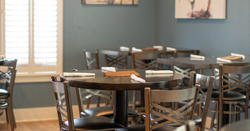 Interior, round tables set and ready for guests