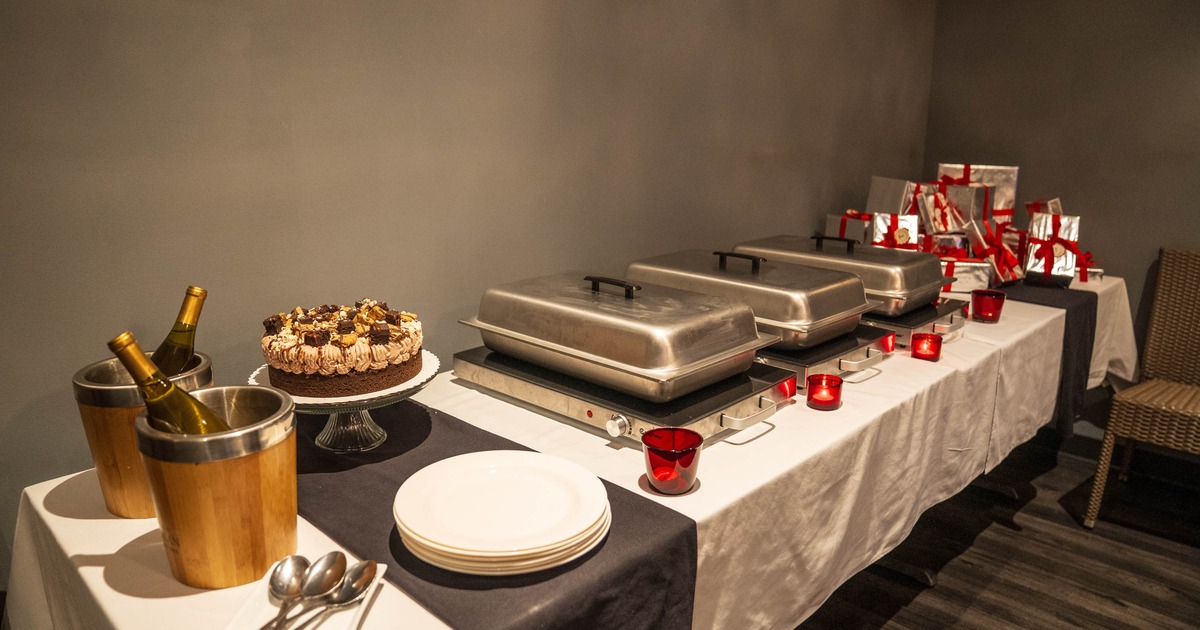 Buffet setup with serving trays and plates
