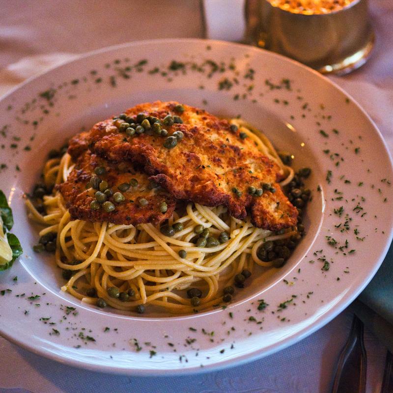 Lemon Caper Chicken over Garlic Pasta photo