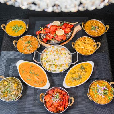 Assortment of dishes served on the table with sides.