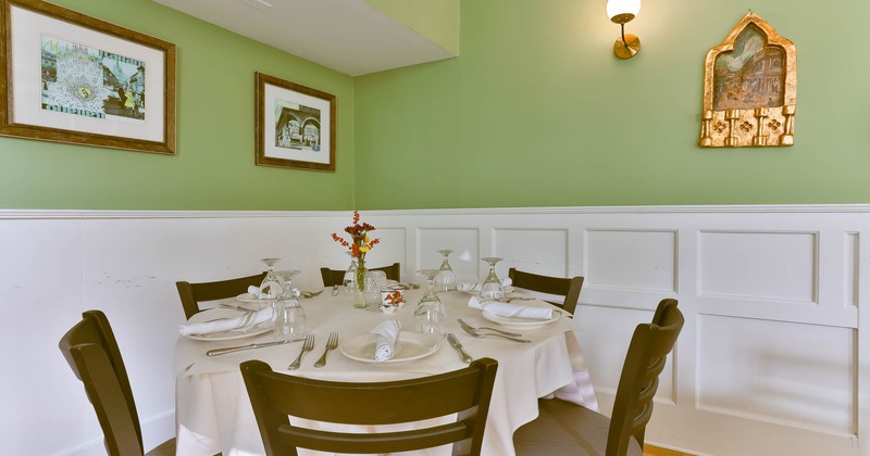 Interior, round table with chairs ready for guests