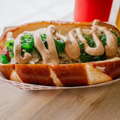 New York dawg topped with relish and a drizzle of sauce.