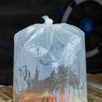 Seafood boil bag filled with assorted shellfish and seasoning.