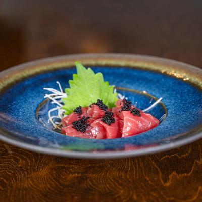 Tuna sashimi topped with black caviar.