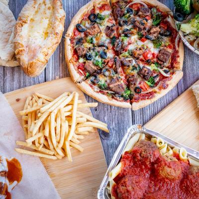 An array of delicious foods on a wooden table.