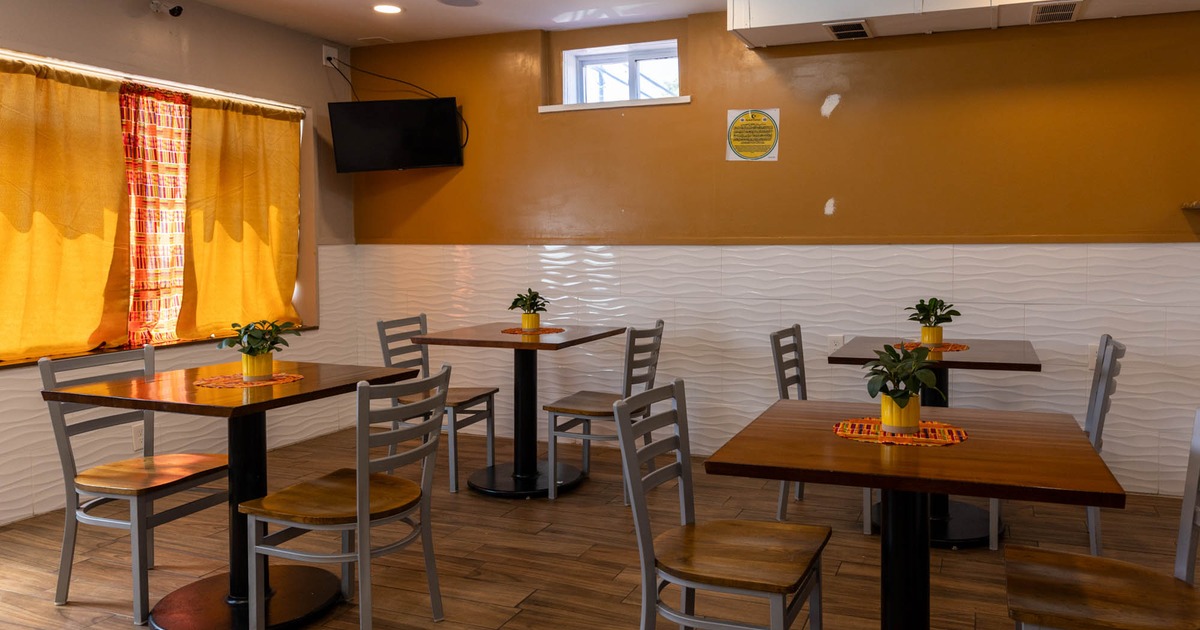 Interior, dining tables and chairs, TV screen on the wall