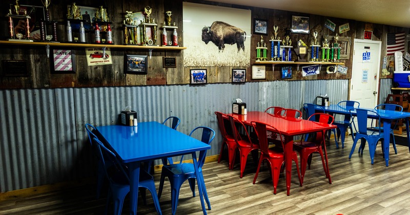 Interior, seating area with metal tables and chairs