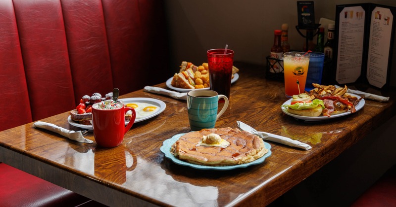 Assortment of breakfast dishes and drinks served on the table