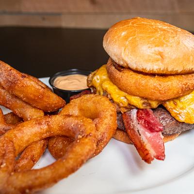 Western Burger with BBQ pulled pork, bacon, cheddar and onion rings.