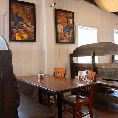 Wooden tables, benches, and chairs.