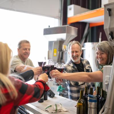 People toasting with their drinks.