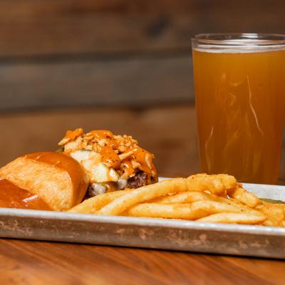 Smoked Burger, with goat cheese, caramelized onion glaze, crispy onions, and fries.