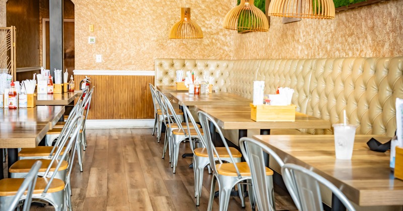 Interior, a leather banquette with tables and chairs
