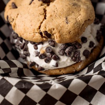 Ice cream cookie sandwich with chocolate chips.