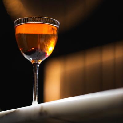 Masamune cocktail, with Japanese whiskey, Campari, Saint Germain, and orange bitters.