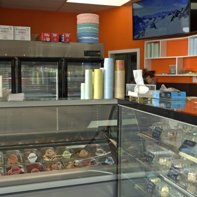 Interior, display cases  with pastry items and gelato.