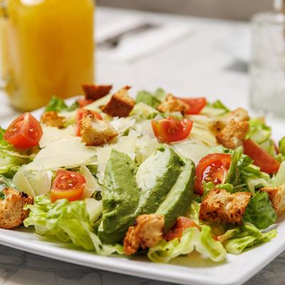 Caesar salad with avocado.