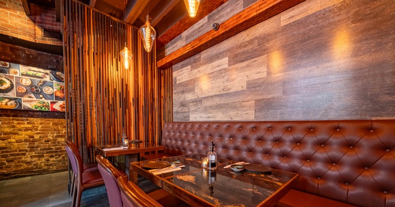 Cozy restaurant interior with brown leather bench seating