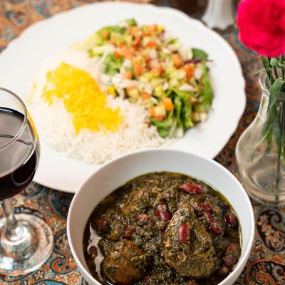 Beef stew, a drink, and other food.