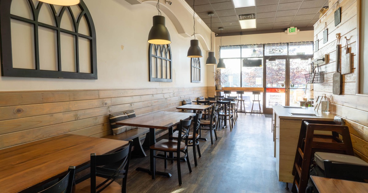 Inside, dining tables and chairs, entrance