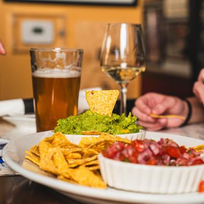 A close up of Twisted Sister Platter served with beer and wine.