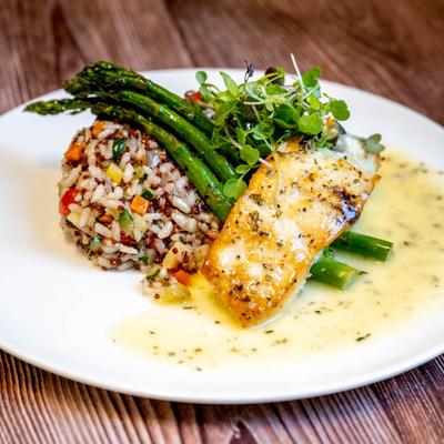 Roasted Halibut served with rice, asparagus and topped with microgreens.