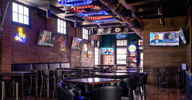 Seating area, TV screens on the walls