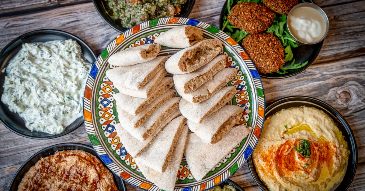 Assorted dips with pita and falafel basket