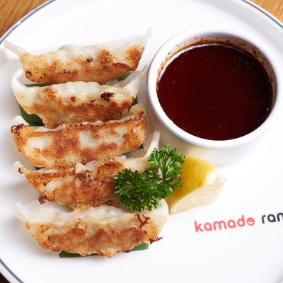Gyoza dumplings with dipping sauce.