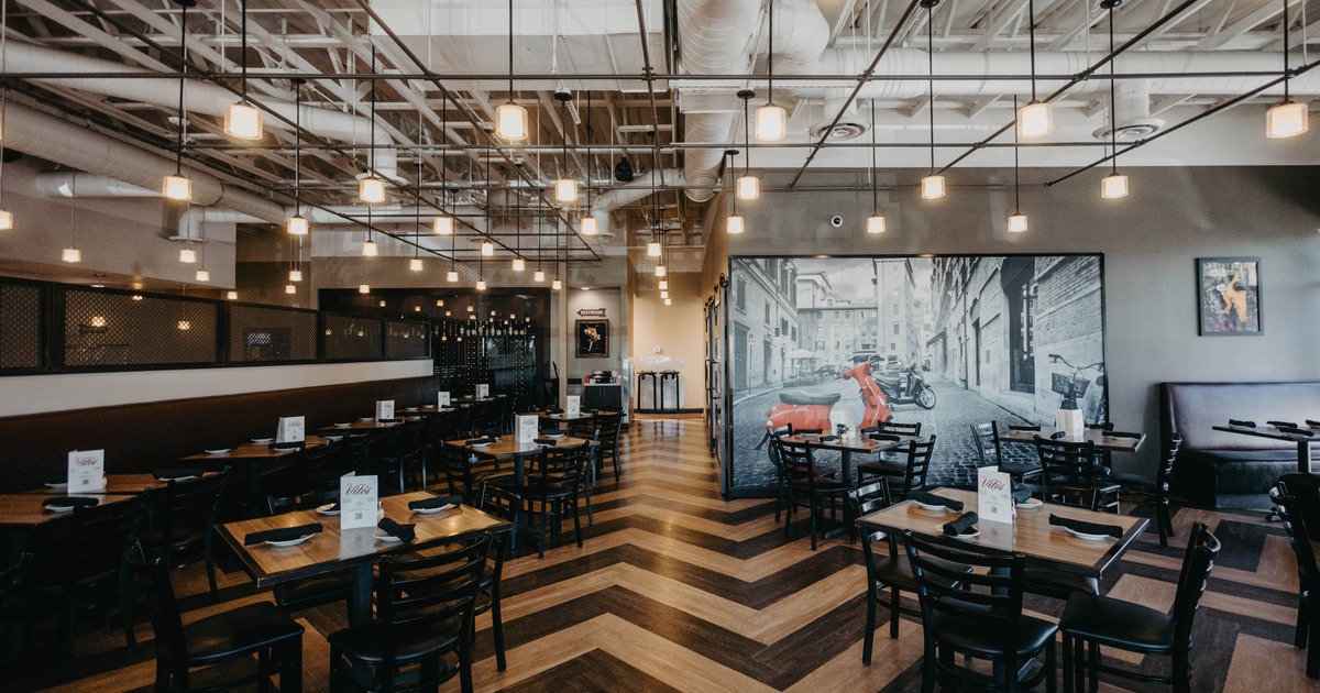 Interior, zigzag wood flooring, black chairs, and pendant lighting, wall mural