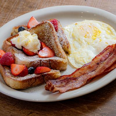 French Toast Combo with berries, eggs, and bacon.