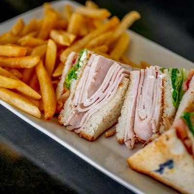 Turkey Club sandwich, and fries.