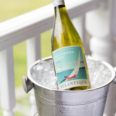 Bottle of Sauvignon Blanc chilling in an ice bucket on the porch.