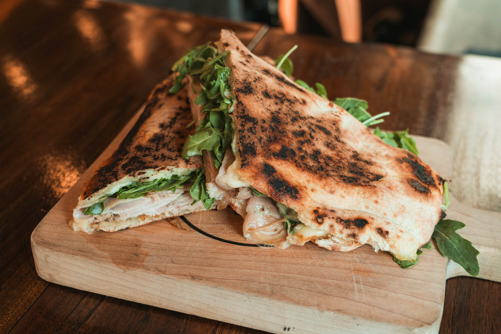Panuozzi di Bartolomei Homemade mozzarella, sliced roast pork, baby arugula