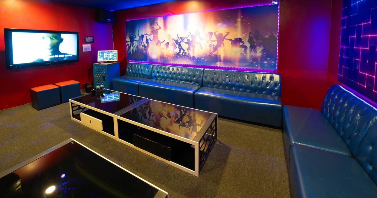 Interior, tufted sofas, TV, tables, decorations